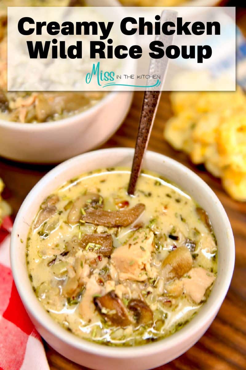 Creamy Chicken Wild Rice soup in a bowl - text banner overlay.