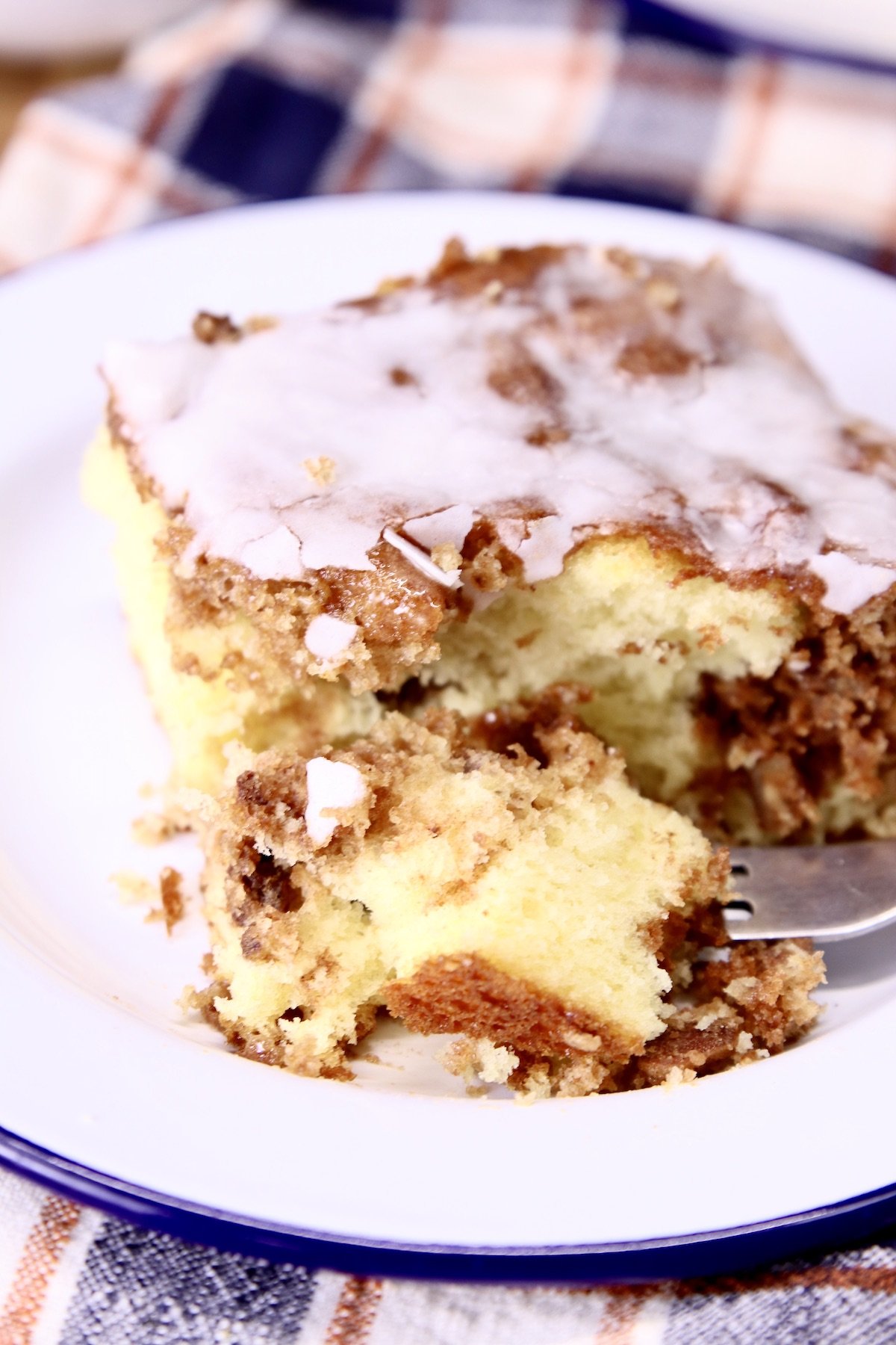 cinnamon coffee cake slice with a bite on fork