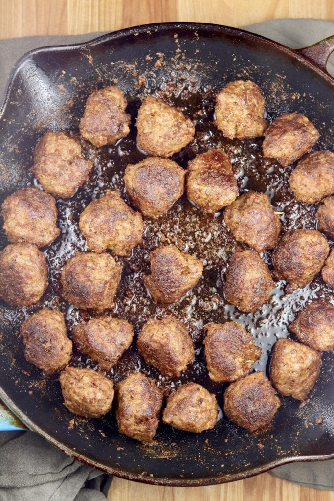 Browned meatballs in a skillet