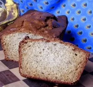 Loaf of Banana Bread With One slice.