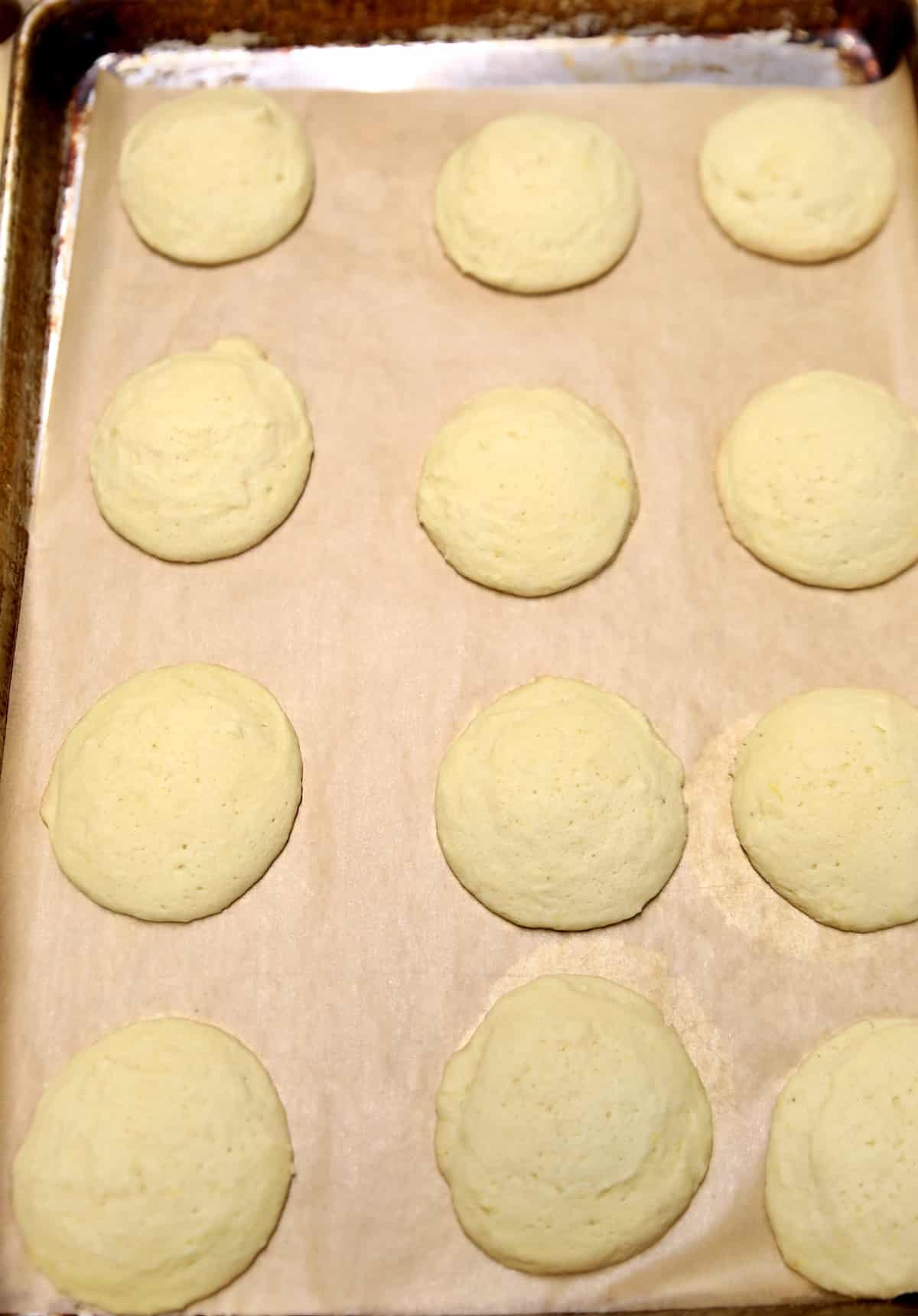 Lemon cookies baked on a baking sheet.