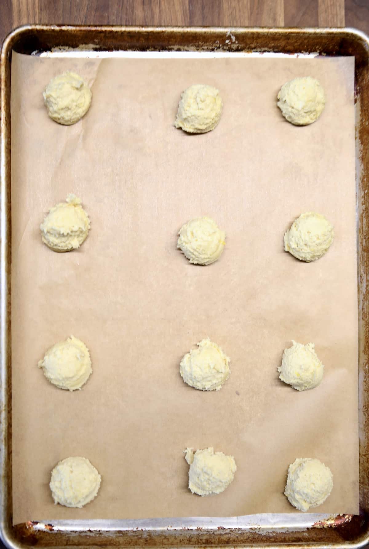 Lemon cookie dough on a baking sheet.