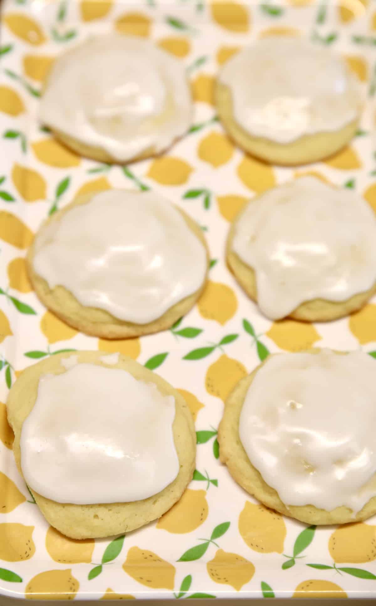 Lemon Butter cookies with icing on a lemon platter.