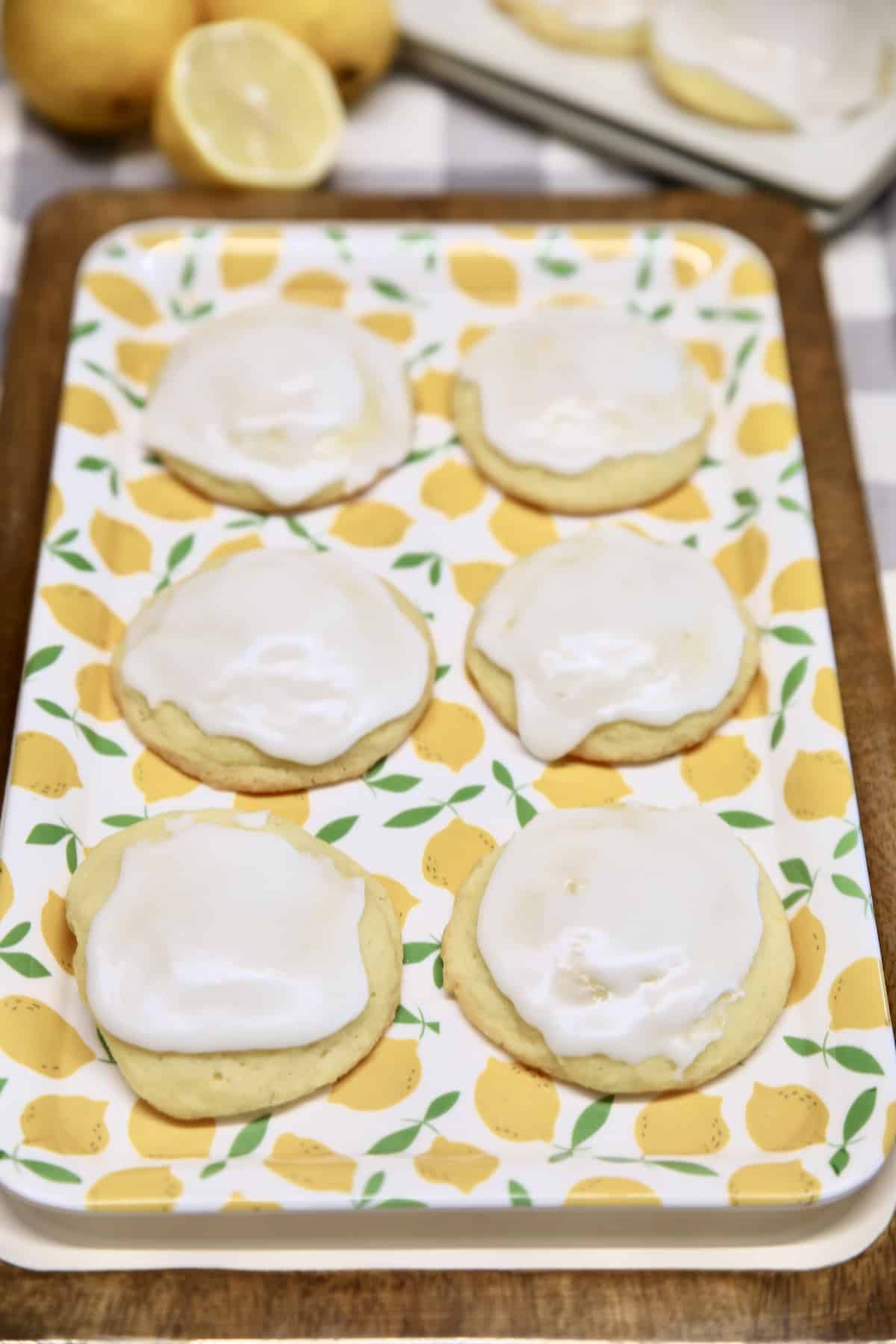 Lemon butter cookies with icing on a platter.