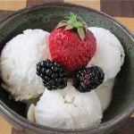 Bowl of vanilla ice cream with berries