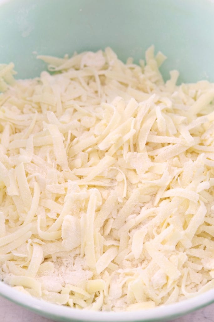 Shredded cheese in biscuit dough