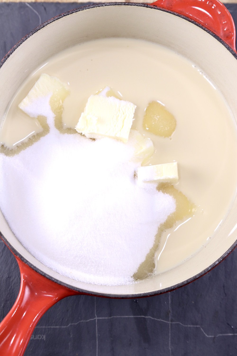 saucepan with sugar, butter and evaporated milk for making fudge