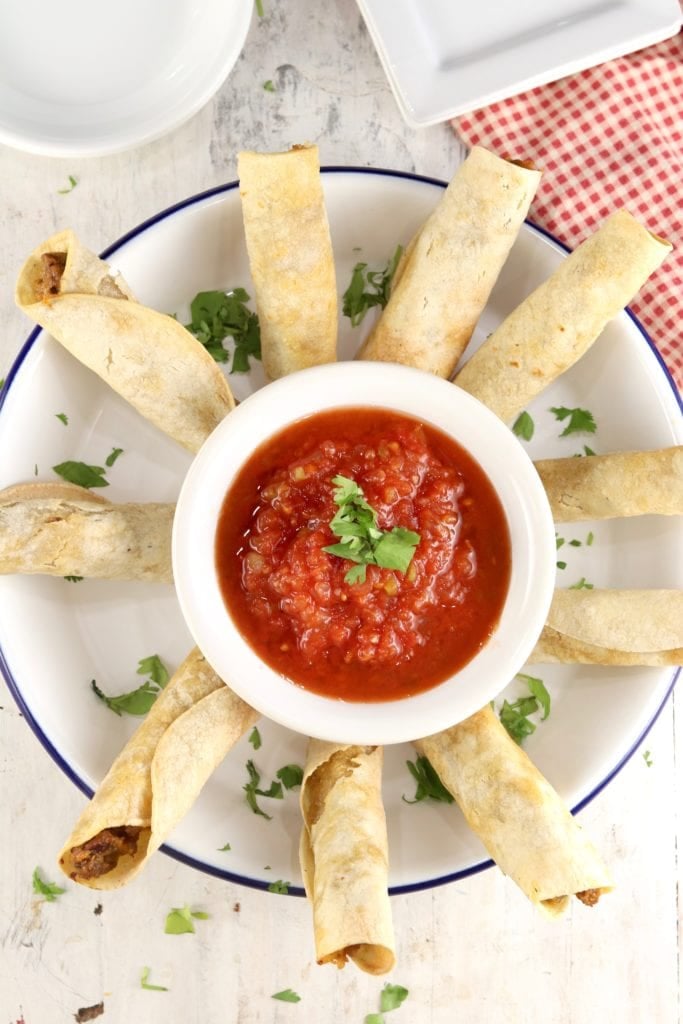 Taquitos appetizers with salsa