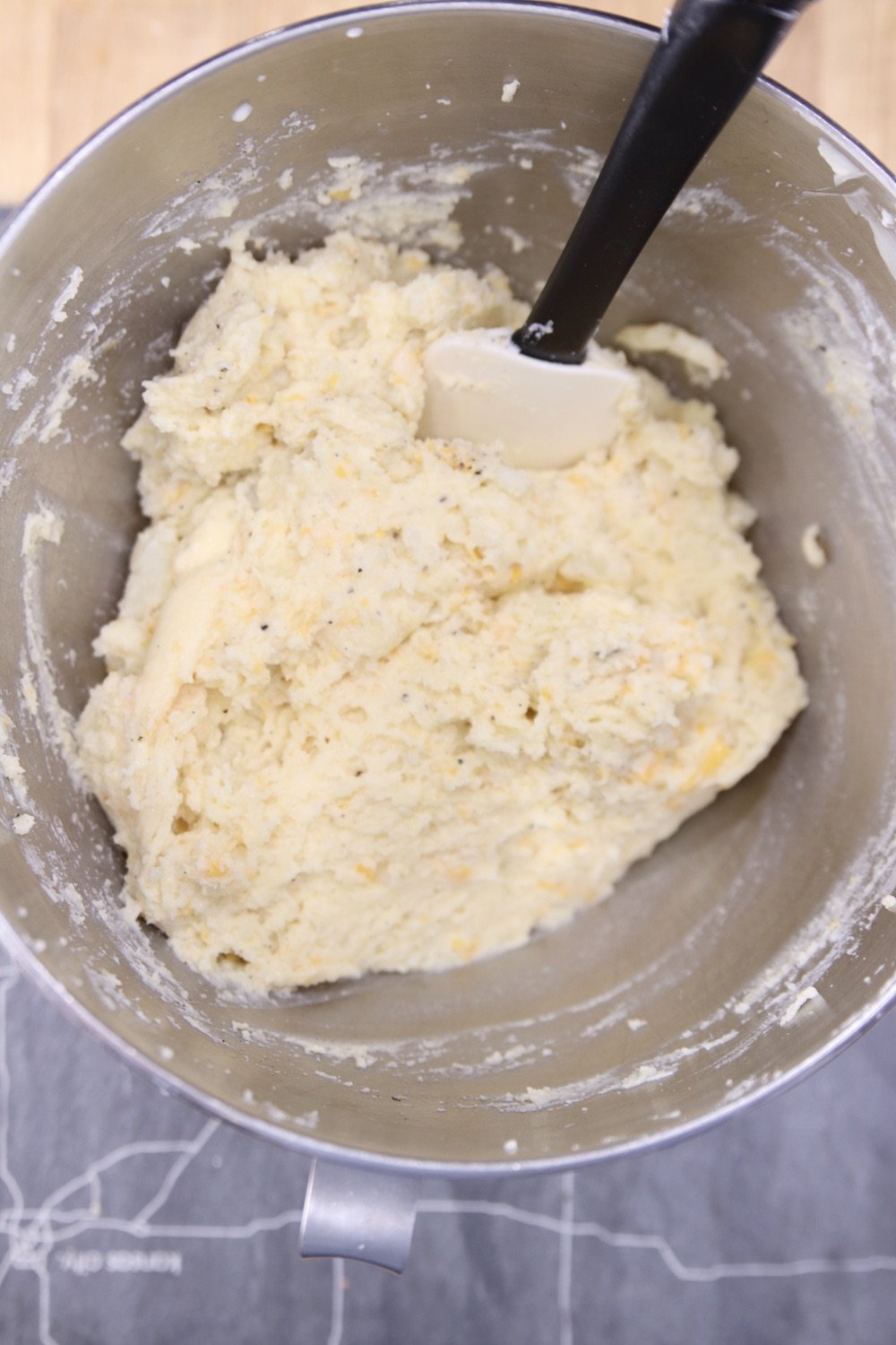 Mashed potato mixture in a bowl with cheese