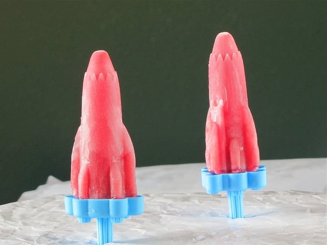 Watermeon popsicles in blue mold handle