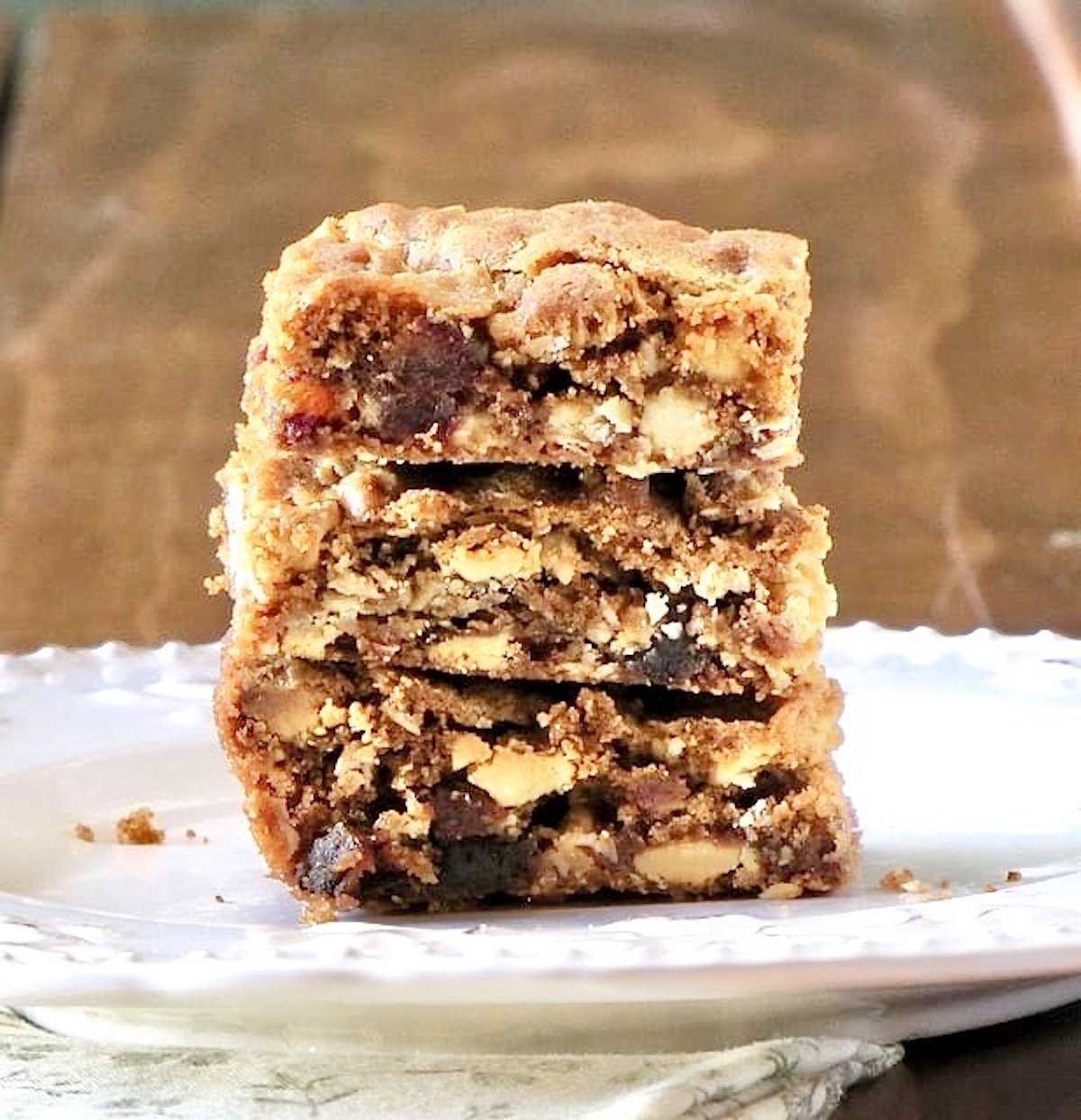 white chocolate date bars stacked on a plate