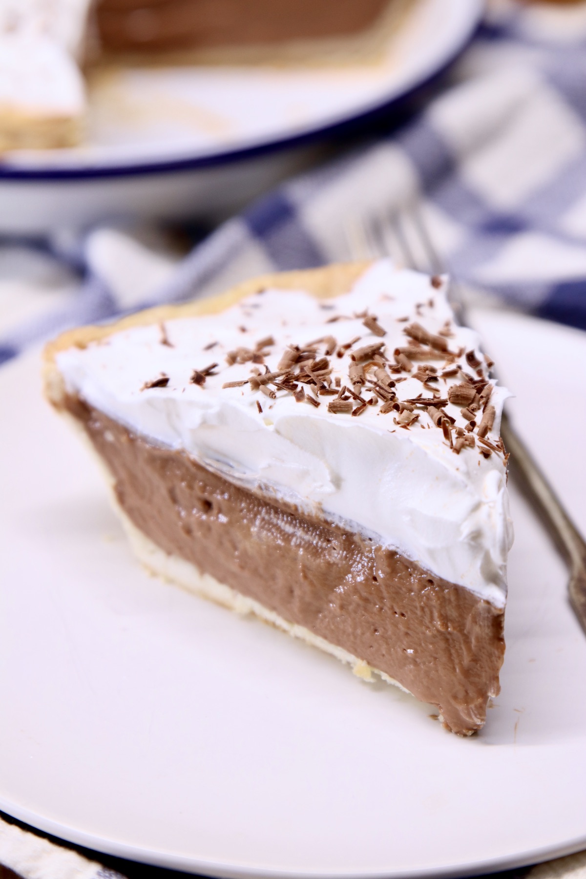 slice of chocolate pie with whipped cream and chocolate shavings