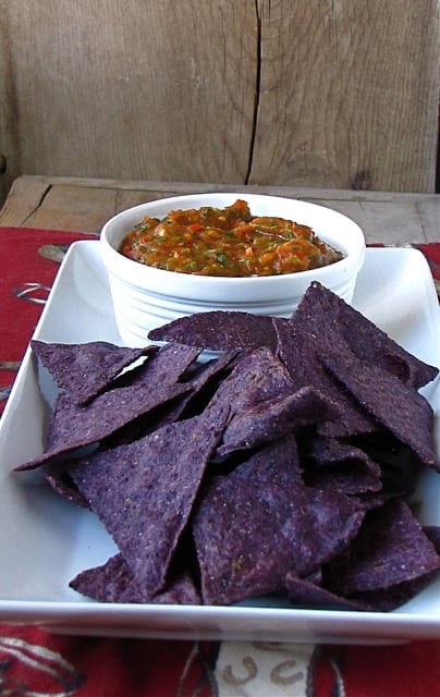 Salsa in bowl with Blue corn tortilla chips.