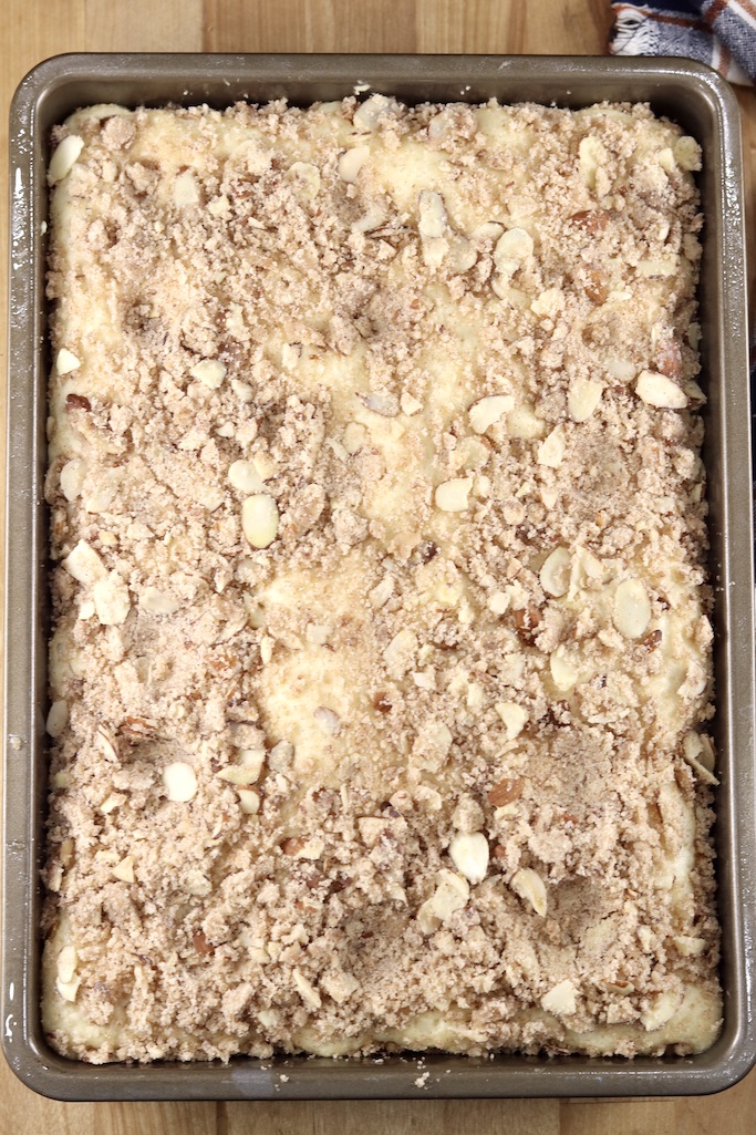 9 x 13 pan with almond streusel coffee cake ready for oven