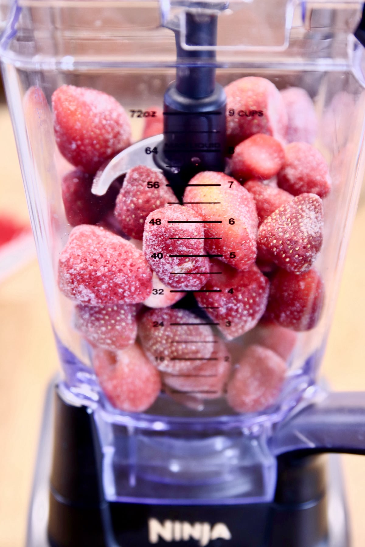 frozen strawberries in a blender