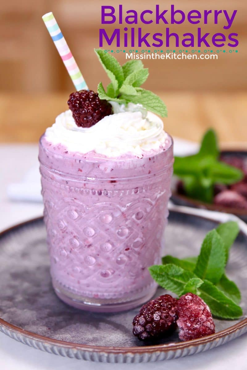 Blackberry Milkshake in a glass with straw. Text overlay.