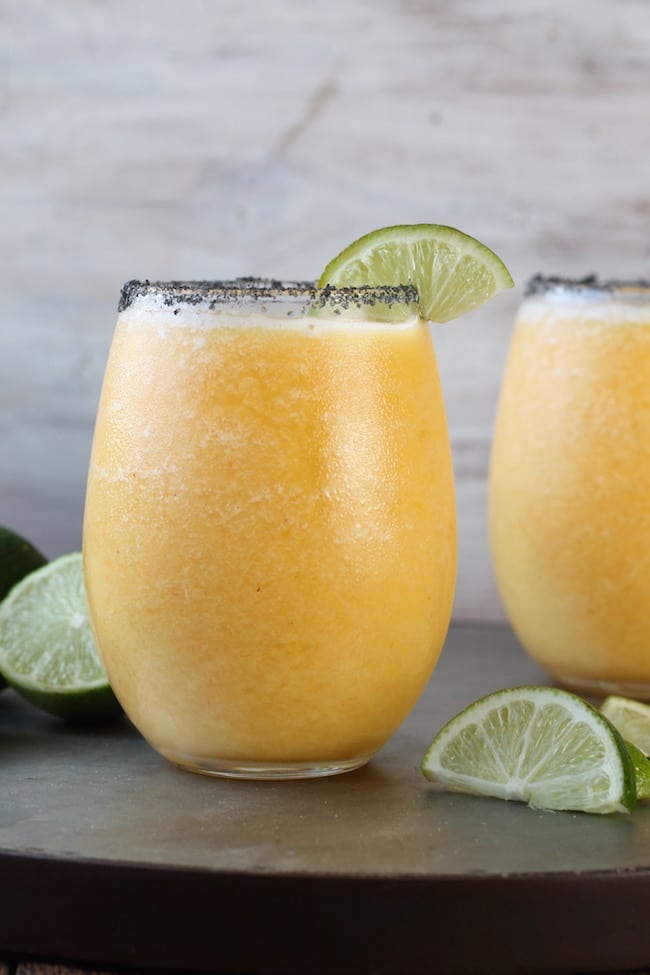 Frozen Peach Margaritas with limes