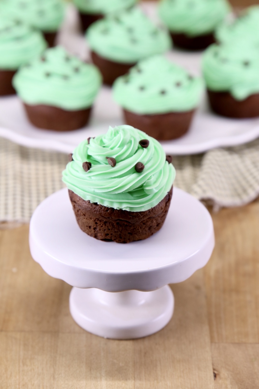 Chocolate cupcake with mint icing on a cupcake pedestal
