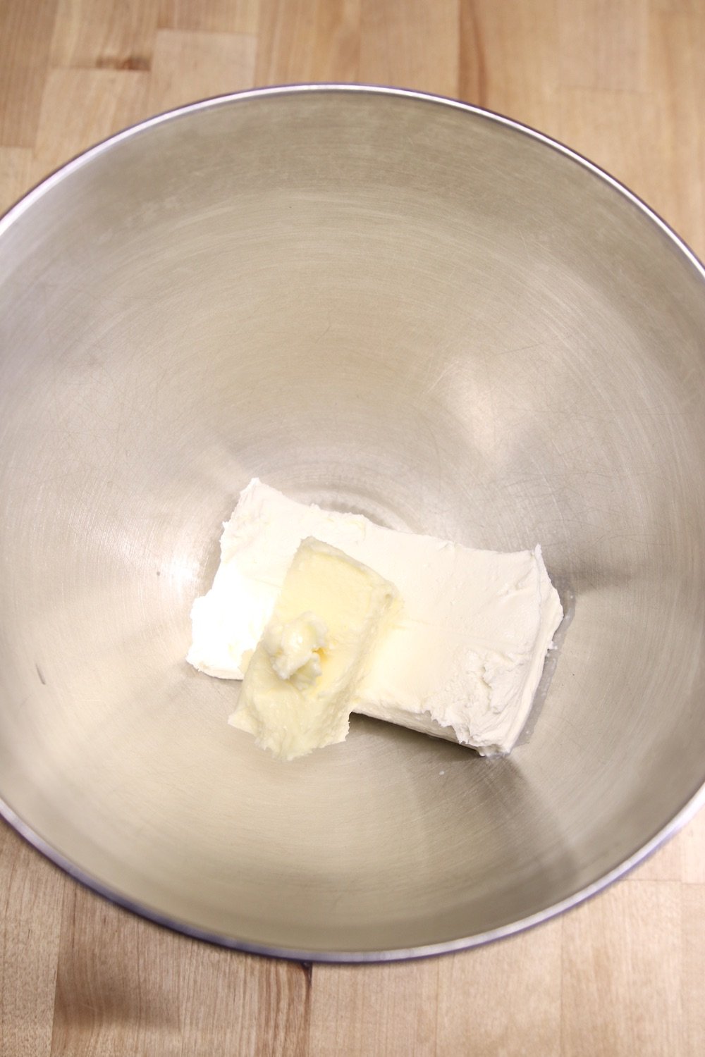 cream cheese and butter in a mixer bowl