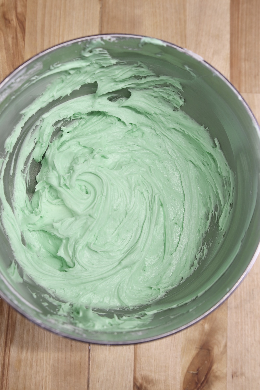 mint cream cheese frosting in a mixer bowl