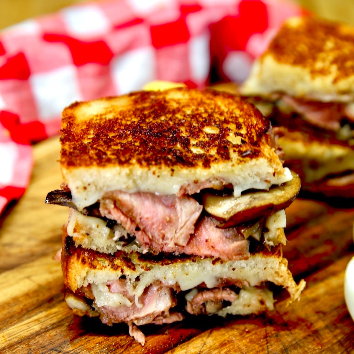Steak mushroom swiss grilled cheese stacked