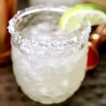 Margarita in a glass with slice of lime.