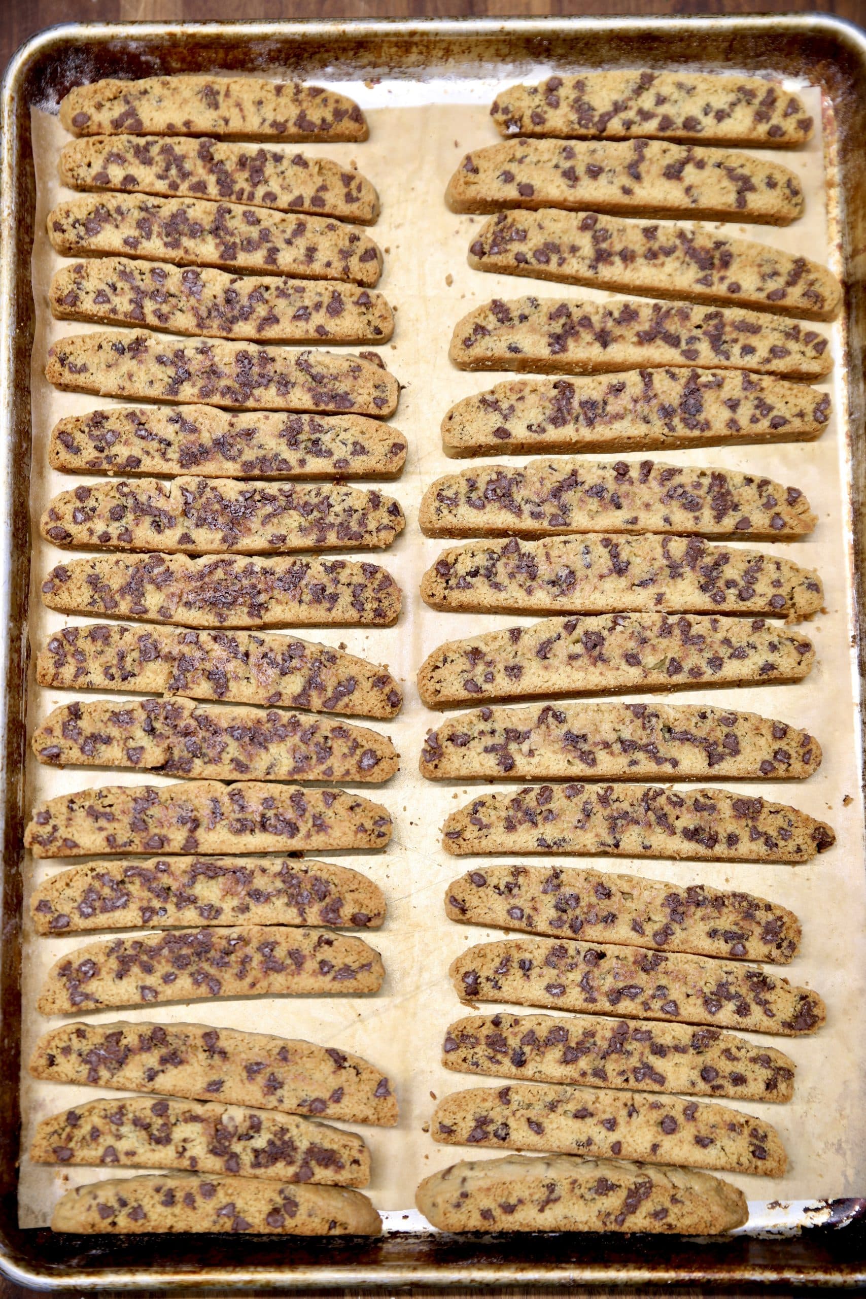 Chocolate chip biscotti on a sheet pan.