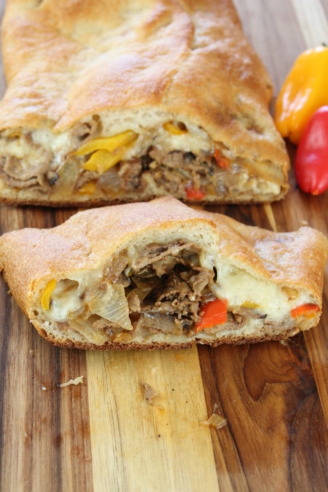Easy Cheesesteak Stromboli is a quick and delicious family-friendly meal. Ready in just 30 minutes. From Miss in the Kitchen 