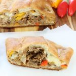 Easy Cheesesteak Stromboli is a quick and delicious meal ready in just 30 minutes. Recipe from missinthekitchen.com