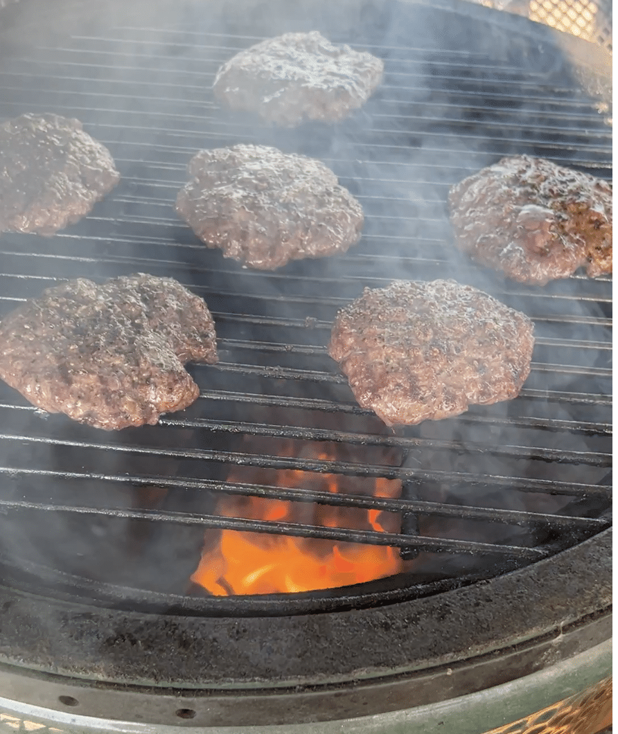 Cooking burgers on a grill.