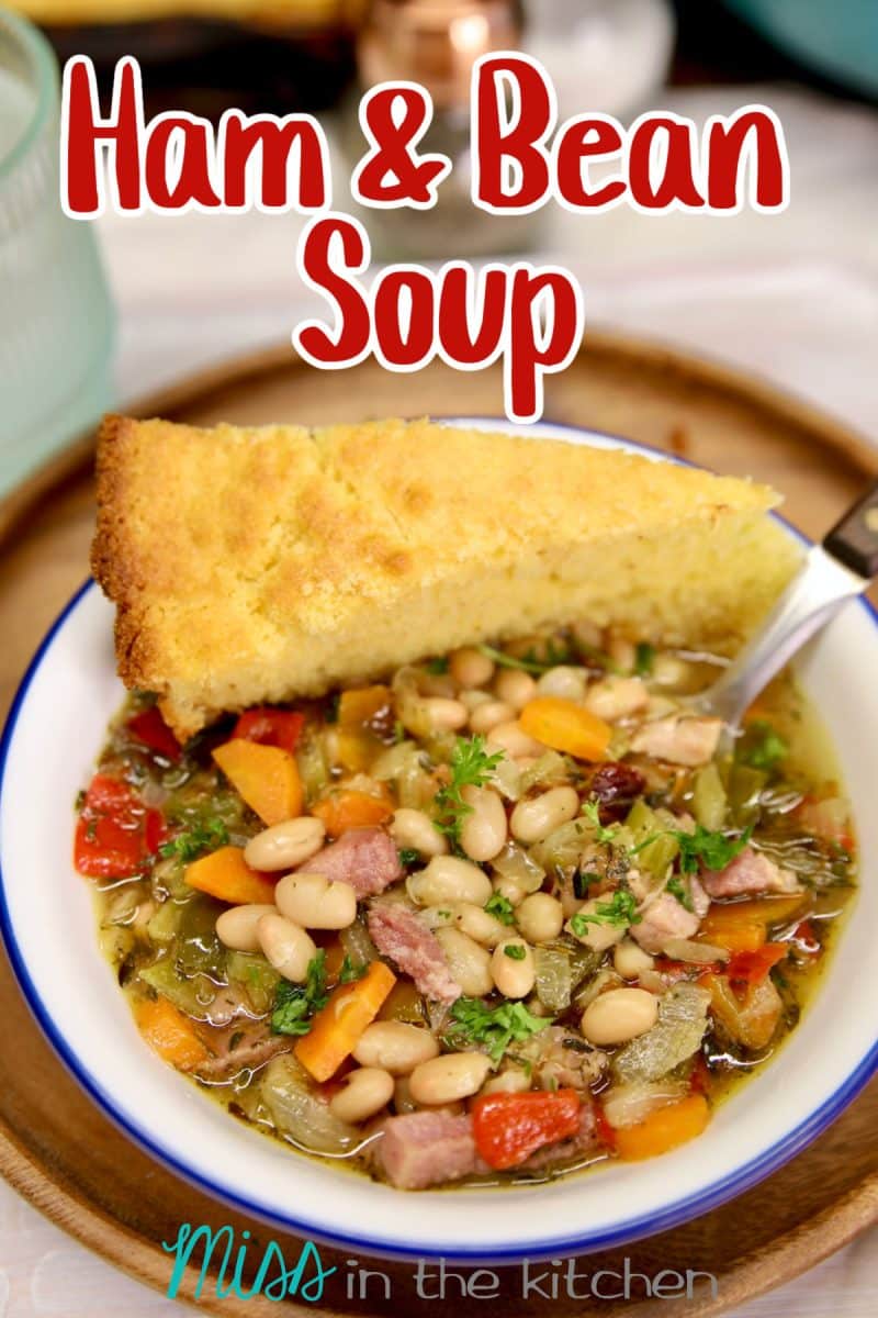 Ham & Bean Soup in a bowl with wedge of cornbread. Text Overlay.