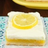 Lemon Bars with Cream Cheese Icing is a delicious dessert recipe for any party or family get together. From MissintheKitchen.com