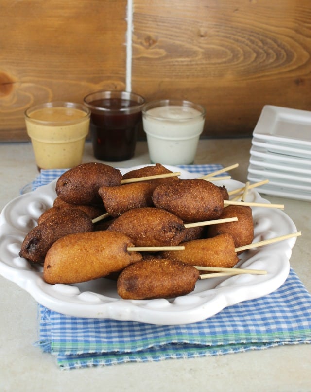 Sausage Corn Dog Bites are a tasty bite- sized snack for family get togethers and game day parties. Get the recipe from MissintheKitchen.com
