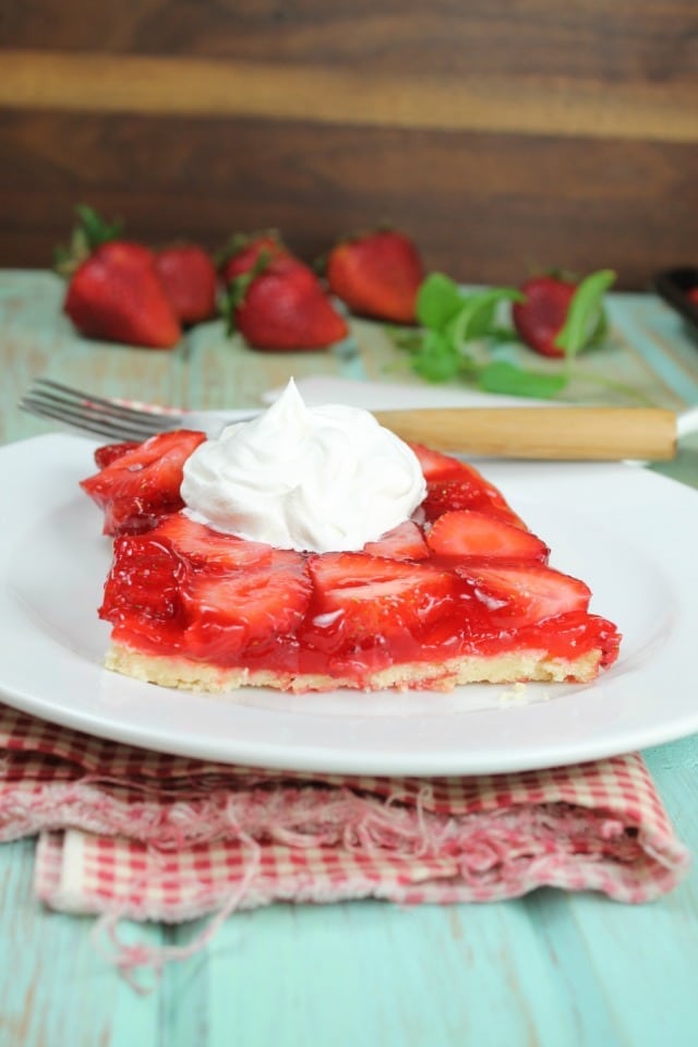 This Strawberry Slab Pie is a spin on my favorite fresh strawberry pie. Perfect for picnics and cookouts. From MissintheKitchen.com