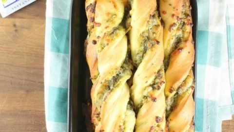 Cheesy Pesto Breadsticks are the perfect side for any meal. Packed with ooey gooey mozzarella cheese and tons of flavor from the sweet basil pesto. Made with Red Star Yeast. Recipe from missinthekitchen.com #ad