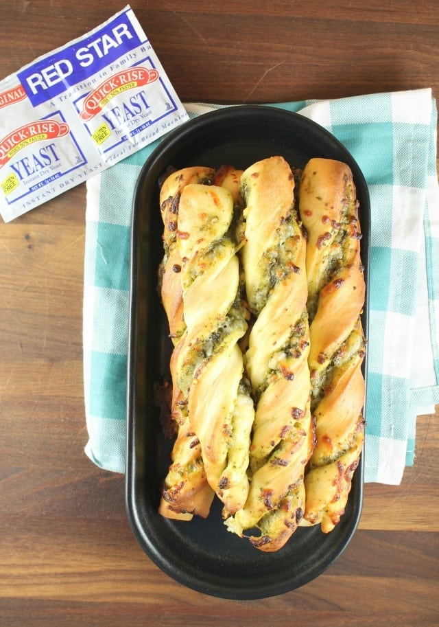 Cheesy Pesto Breadsticks are the perfect side for any meal. Packed with ooey gooey mozzarella cheese and tons of flavor from the sweet basil pesto. Made with Red Star Yeast. Recipe from missinthekitchen.com #ad