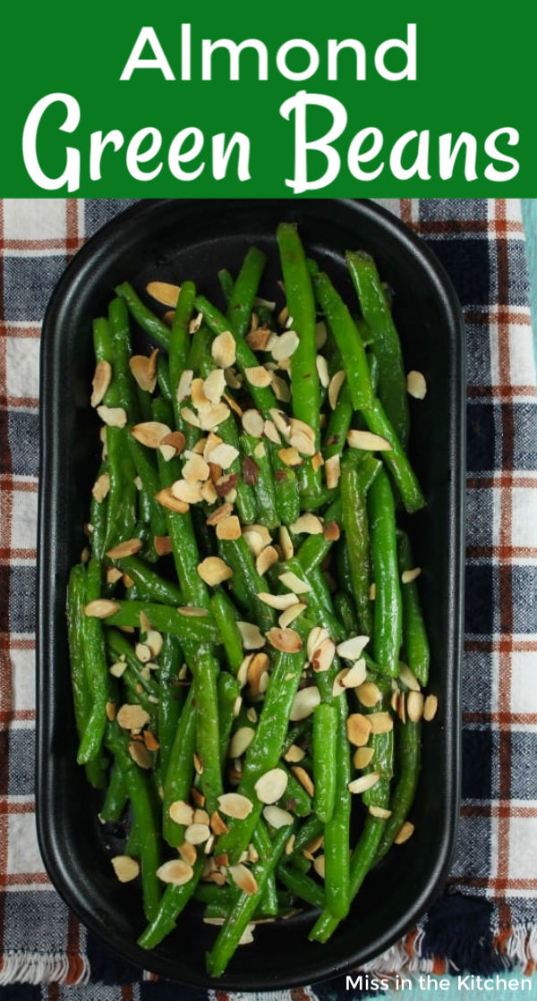 Green Beans with Toasted Almonds on a black plattter