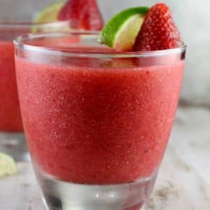 Closeup of strawberry daiquiri in a glass with garnish.