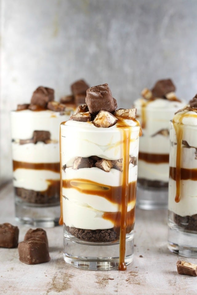 Easy No Bake Snickers Cheesecake Recipe is a decadent dessert for any occasion! MissintheKitchen.com