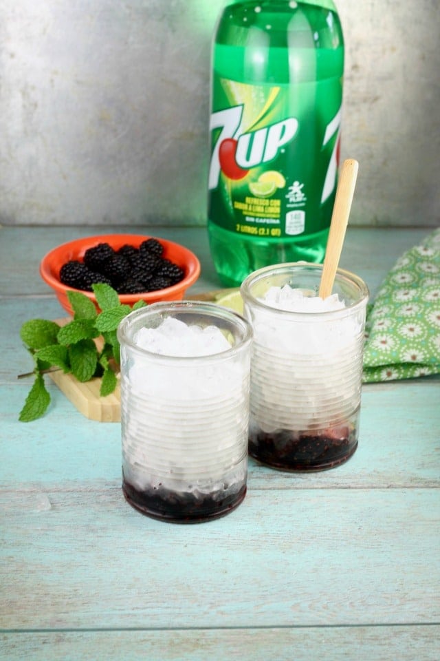 Adding ice to Easy Blackberry Mojitos Recipe made so simply with 7UP! Get the recipe and more at MissintheKitchen.com #ad #MixItUpALittle