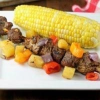 Balsamic Pork Skewers with Pineapple, Sweet Peppers and Onions grilled to perfection for the best summer meal! From MissintheKitchen.com