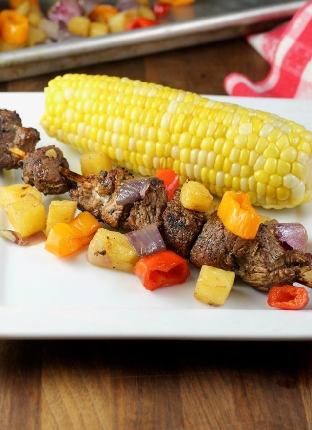 Balsamic Pork Skewers with Pineapple, Sweet Peppers and Onions grilled to perfection for the best summer meal! From MissintheKitchen.com