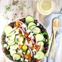 Greek Salad with Roasted Garlic Salad Dressing Recipe ~ A flavor packed salad that works as a side dish or main dish salad for any night of the week. From MissintheKitchen.com