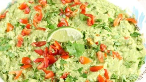 Roasted Garlic Guacamole is a delicious party appetizer or a must- have for taco night! From MissintheKitchen.com