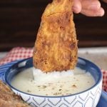 Chicken Fried Bacon dipped in gravy makes the most amazing breakfast or serve it as an appetizer! Recipe from MissintheKitchen.com