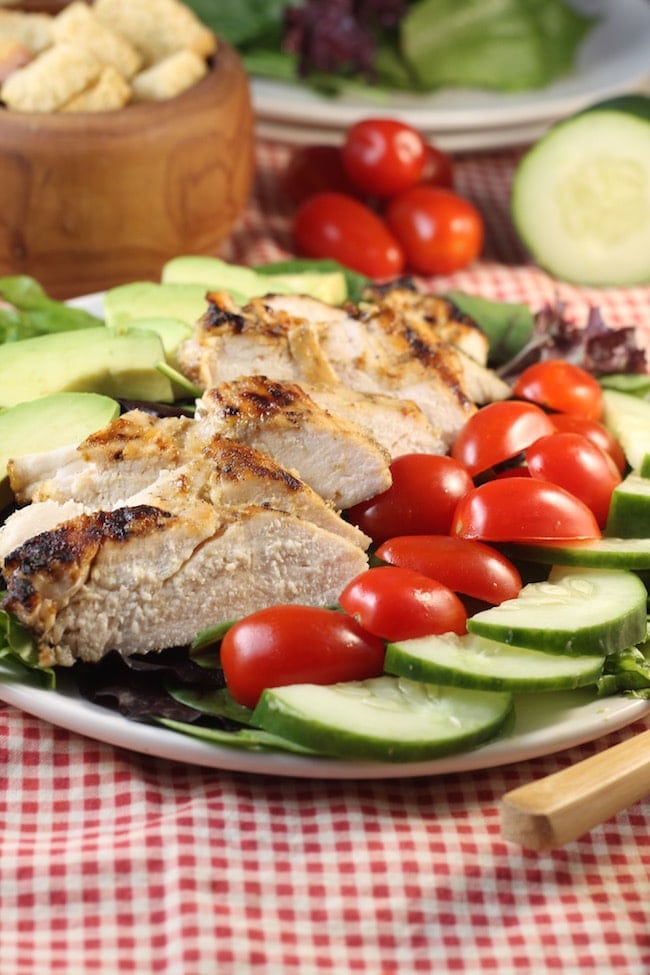Grilled-Chicken-Salad-on-a-plate- with-tomatoes-cucumbers-avocados