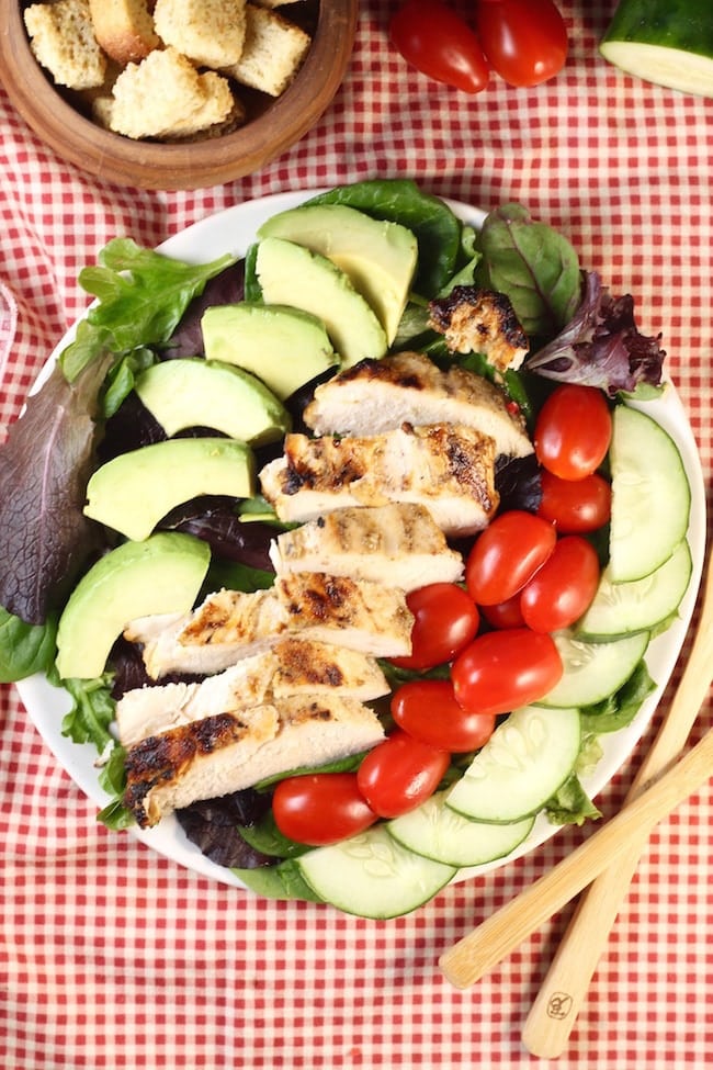 Grilled-Chicken-Salad-Overhead-view-on-red-gingham-napkin