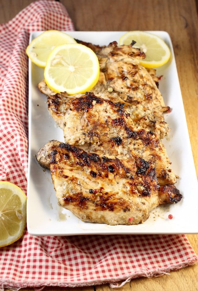 Grilled-Chicken-Breasts-with-Lemon-Slices-on-platter