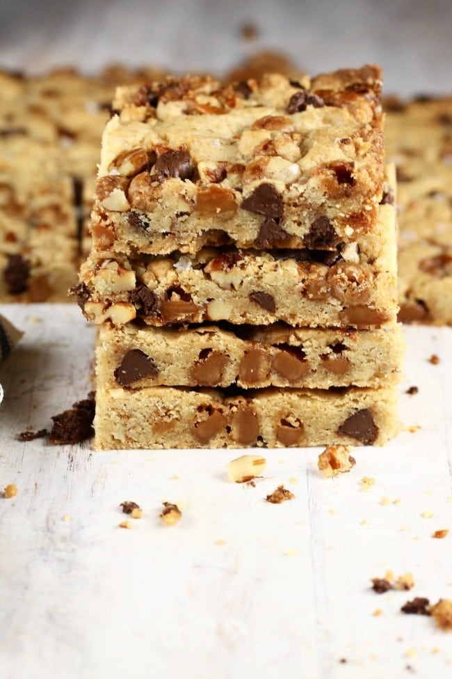 Stack of Salted Caramel Cookie Bars with pecans and chocolate chips