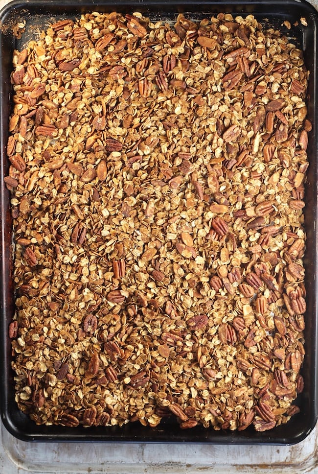 sheet pan of baked easy homemade granola with pecans and almonds